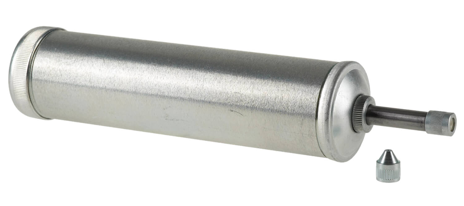 Hochwertige Kolbenstoßpresse mit 300 g Inhalt, mit Zubehörset.